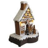 Játszó és mozgó mézeskalács házikó LED-del 23cm