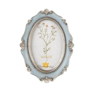 CLEEF.2F0993 Ovál képkeret világoskék, ezüstös díszítéssel, 15x2x20/10x15cm, műanyag